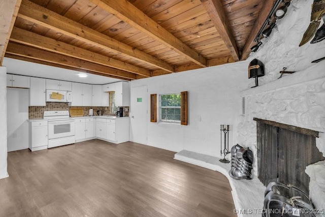 unfurnished living room with a fireplace, wooden ceiling, beam ceiling, and dark hardwood / wood-style floors