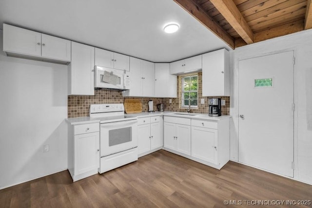 kitchen featuring tasteful backsplash, beamed ceiling, white appliances, and white cabinetry