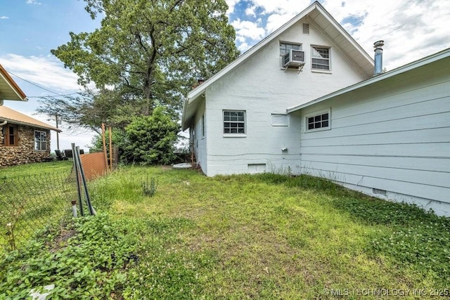 exterior space with cooling unit and a yard