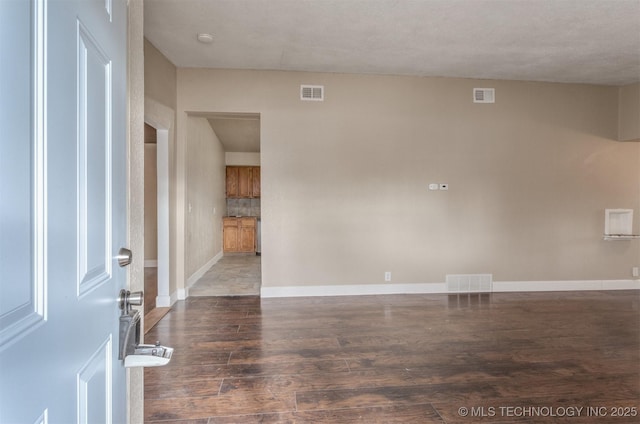 unfurnished room featuring dark hardwood / wood-style floors