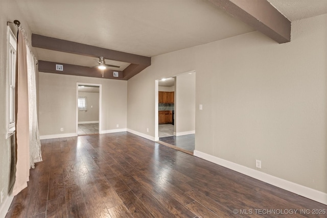 empty room with ceiling fan, beam ceiling, and dark hardwood / wood-style floors