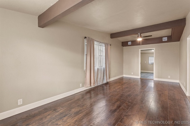 empty room featuring ceiling fan, dark hardwood / wood-style flooring, and beam ceiling