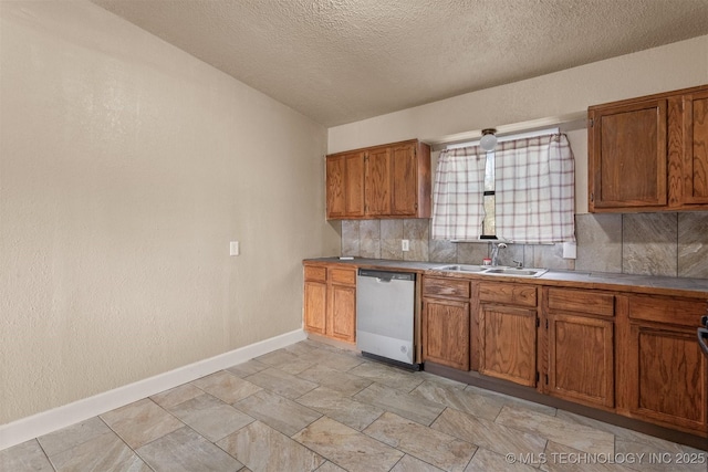 kitchen featuring sink, a textured ceiling, dishwasher, and tasteful backsplash