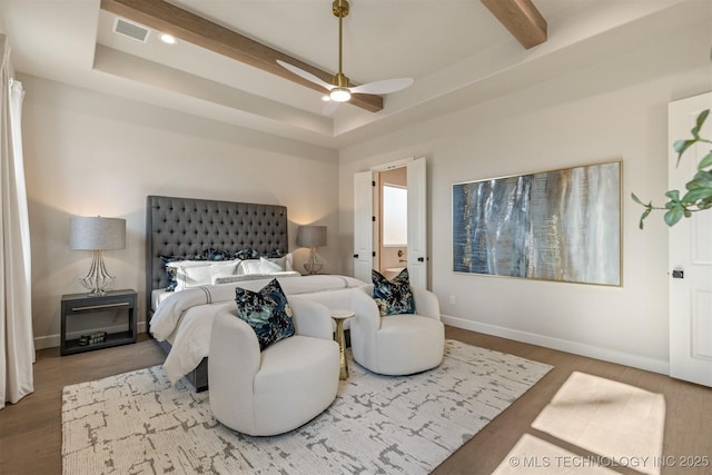 bedroom featuring ceiling fan, a raised ceiling, beam ceiling, and wood-type flooring