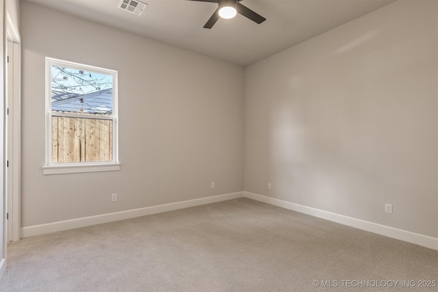 unfurnished room with light carpet and ceiling fan