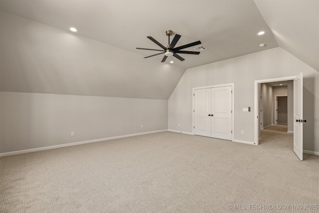 bonus room with ceiling fan, light carpet, and lofted ceiling