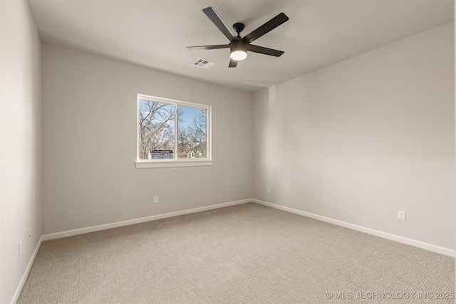 carpeted empty room featuring ceiling fan