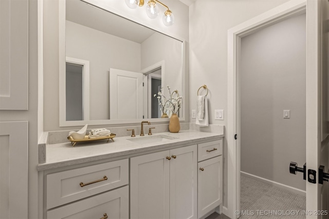 bathroom featuring tile patterned flooring and vanity