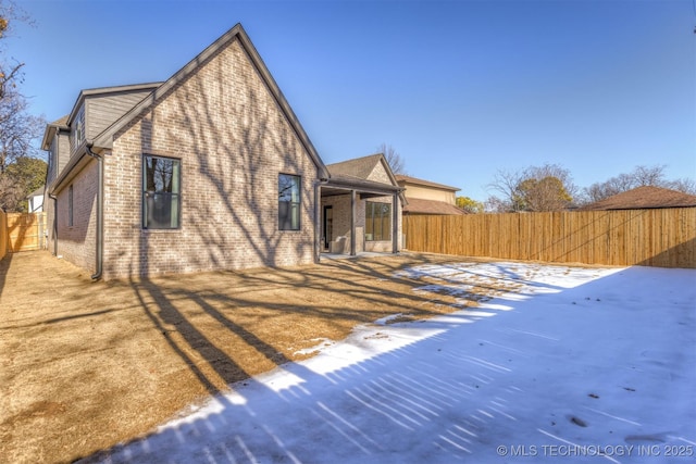 view of snow covered house