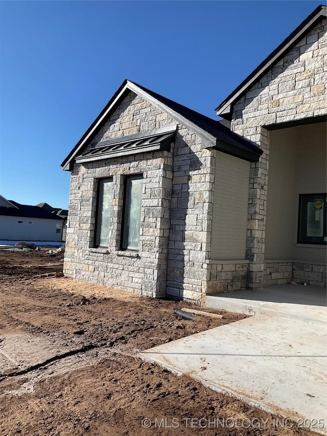 view of home's exterior featuring a patio