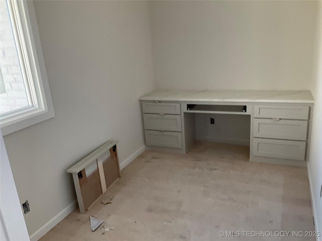 unfurnished office with built in desk