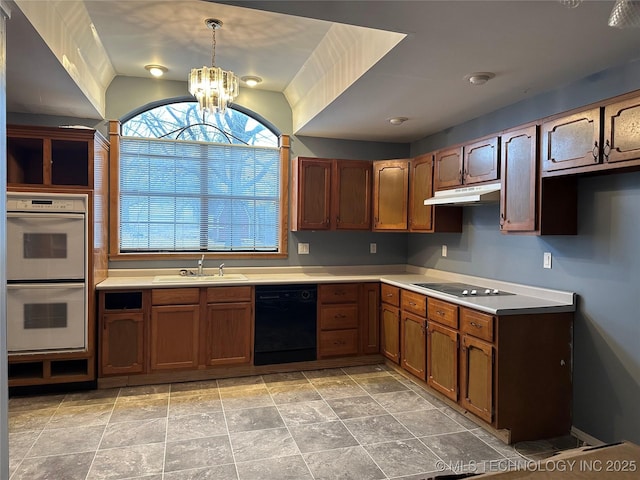 kitchen with hanging light fixtures, sink, an inviting chandelier, and black appliances