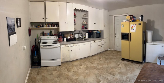 kitchen featuring sink, refrigerator, fridge with ice dispenser, white cabinets, and white electric stove