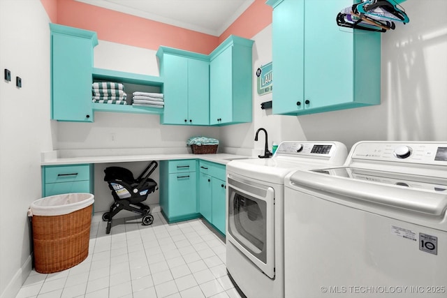 clothes washing area featuring sink, separate washer and dryer, ornamental molding, and cabinets