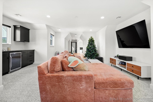 carpeted living room with wine cooler