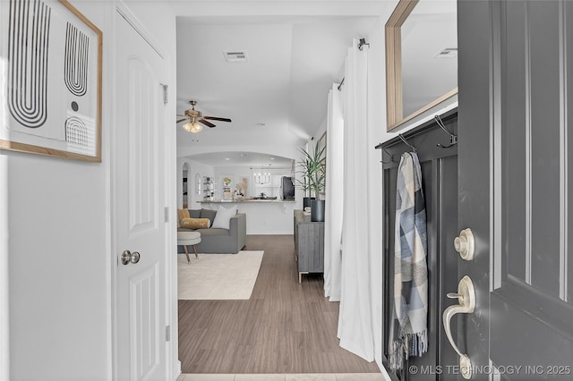 foyer with wood-type flooring and ceiling fan