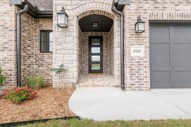 doorway to property featuring a garage