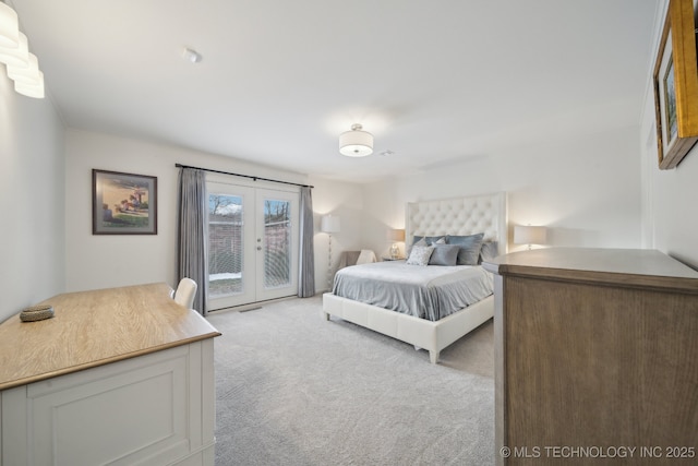 carpeted bedroom featuring access to outside and french doors