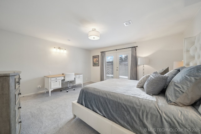 bedroom featuring light carpet, french doors, and access to outside