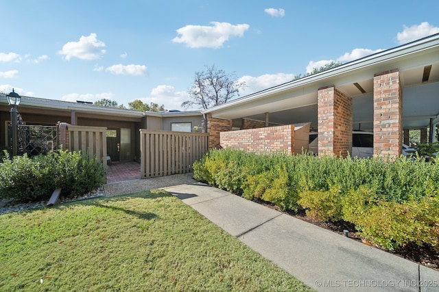 view of side of property featuring a yard