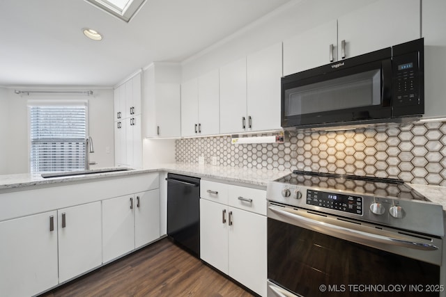 kitchen with dark wood-type flooring, white cabinetry, sink, and black appliances