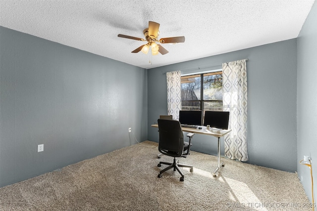 office space with ceiling fan, carpet, and a textured ceiling