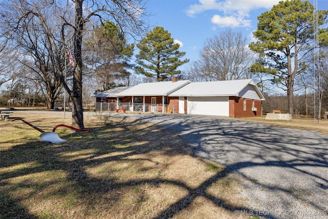 view of front of property featuring a garage and covered porch