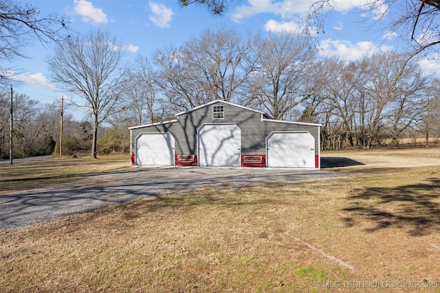 garage with a lawn