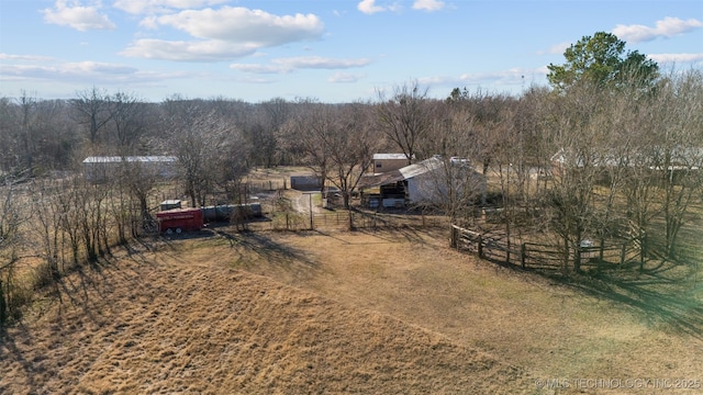 birds eye view of property with a rural view