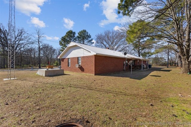 view of side of property featuring cooling unit and a lawn