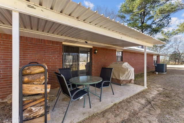 view of patio / terrace with area for grilling and central AC unit