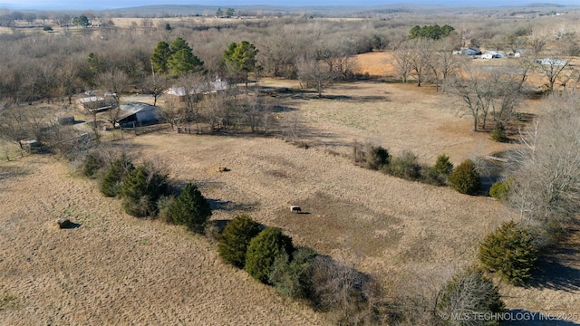 birds eye view of property featuring a rural view