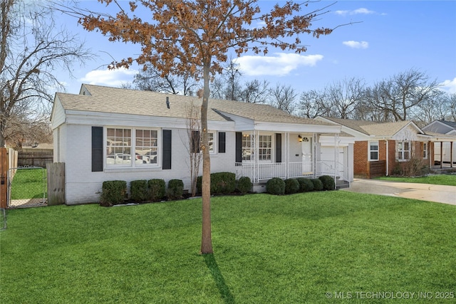 single story home featuring a front lawn, covered porch, and a garage