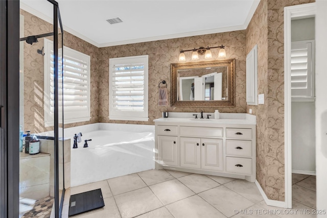 bathroom featuring independent shower and bath, tile patterned flooring, crown molding, and vanity