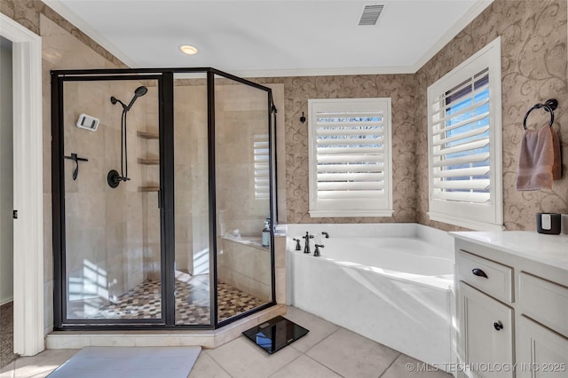 bathroom with tile patterned floors, vanity, crown molding, and shower with separate bathtub