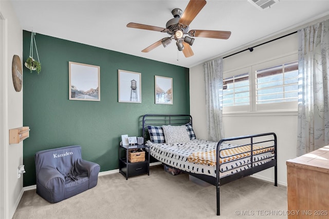 bedroom with light carpet and ceiling fan