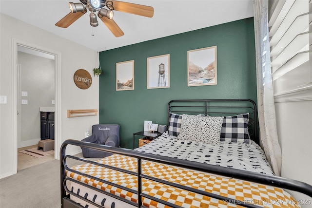 carpeted bedroom with ceiling fan