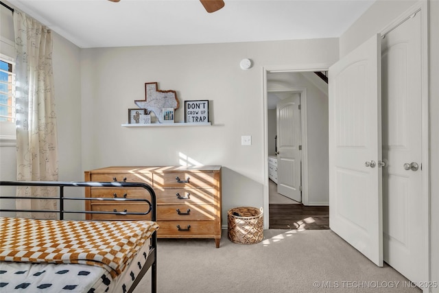 carpeted bedroom with ceiling fan