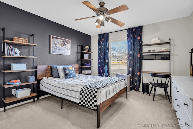 bedroom featuring ceiling fan and light carpet