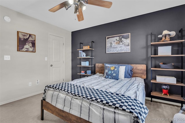 carpeted bedroom featuring ceiling fan