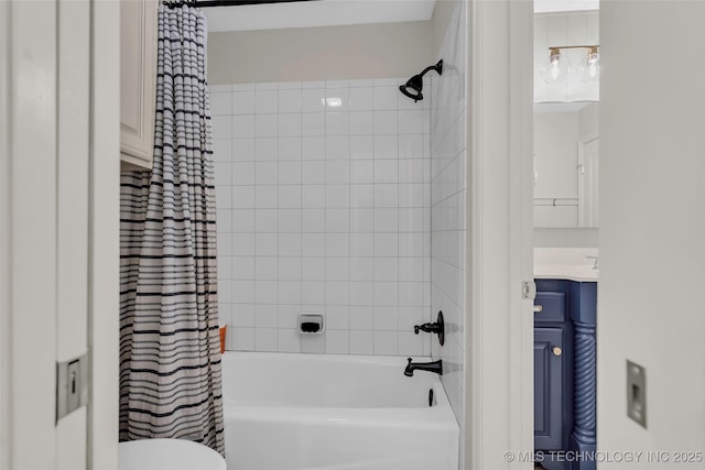 full bathroom with toilet, vanity, and shower / bath combo with shower curtain