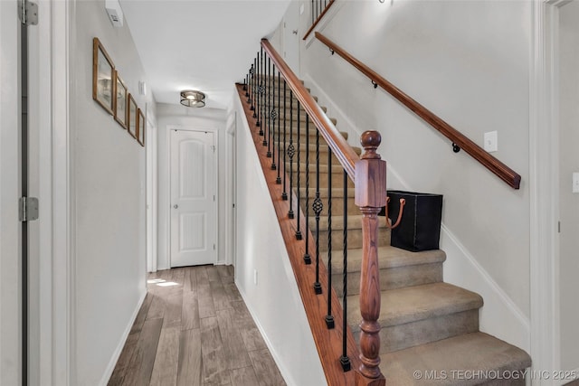 stairway with wood-type flooring