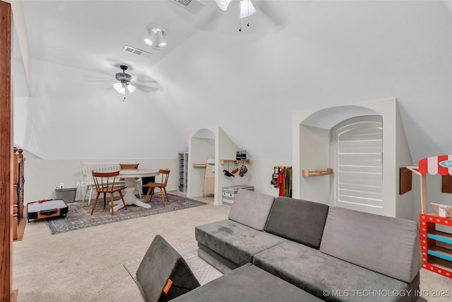 living room with ceiling fan, light colored carpet, and vaulted ceiling