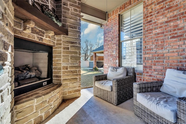 view of patio / terrace with an outdoor stone fireplace