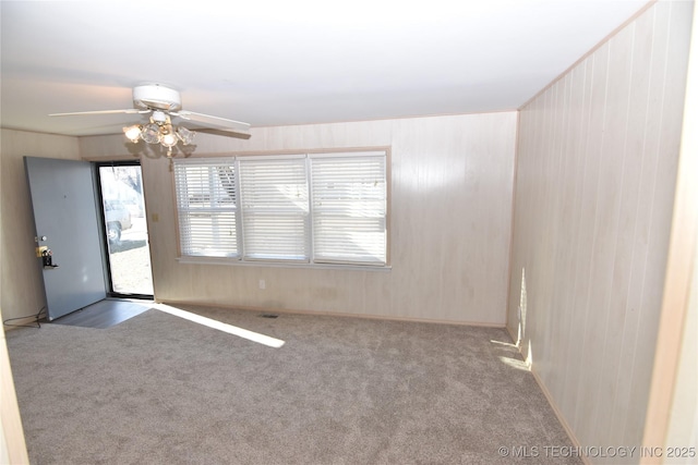 carpeted empty room with ceiling fan