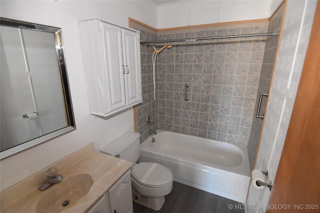 full bathroom with toilet, tiled shower / bath combo, hardwood / wood-style floors, and vanity