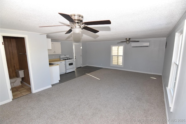 unfurnished living room featuring a wall unit AC, ceiling fan, a textured ceiling, and dark carpet