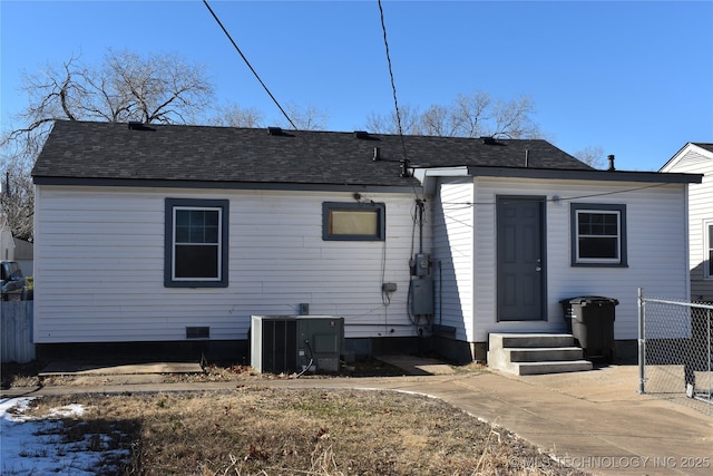 back of property featuring central AC