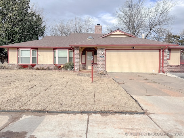 ranch-style house featuring a garage