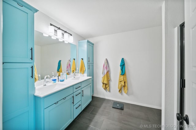 bathroom with tile patterned flooring and vanity